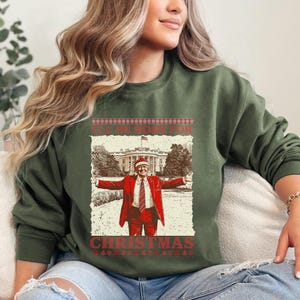 トランプのホリデーホームクリスマススウェットシャツ、ユーモラスなトランプTシャツ、トランプクリスマスセーター、共和党シャツ、ドナルドトランプクリスマスシャツ