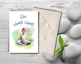 May include: A watercolor illustration of a woman meditating in a lotus position with pink lotus flowers and green leaves. The text "Om shanti shanti" is written in gray lettering.