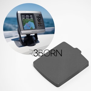 May include: A Garmin GPSmap 62s marine GPS device with a screen showing a map and data. The device is mounted on a black bracket. A dark grey, rectangular cover is also present.