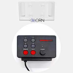 May include: A black Autohelm 4000 autopilot control unit with a red stand-by button, a red auto button, and a black knob labeled rudder. The unit has buttons labeled -1, -10, +1, and +10.