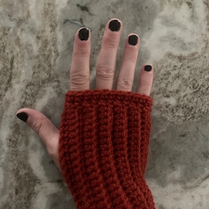 Red fingerless crochet gloves