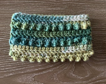 Cartera verde jaspeada con cremallera