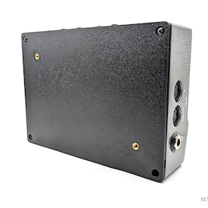 May include: Black audio effects pedal with multiple ports and the text "HX STOMP" printed on the side.