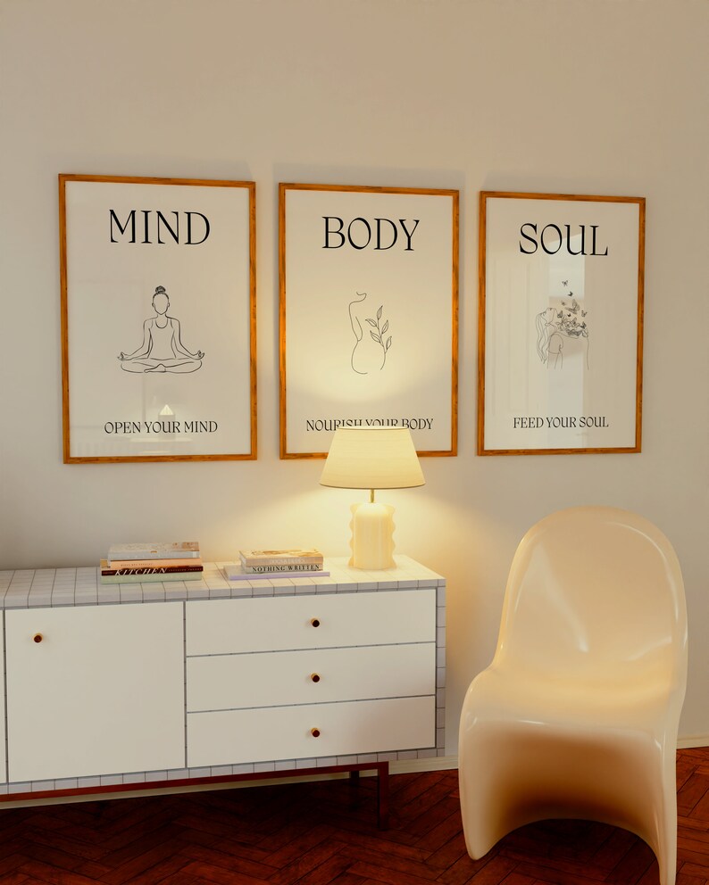 May include: Three framed prints with minimalist line drawings and inspirational text. The prints are titled "Mind", "Body", and "Soul". The text below each print reads "Open your mind", "Nourish your body", and "Feed your soul".