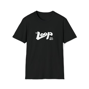 May include: Black t-shirt with a white graphic of the text "The Loop Est. 1977" in a stylized font.