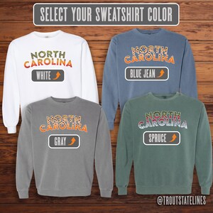 Comfort Colors Sweat
Fly Fishing Shirt
NC Vacation Apparel
NC Travel Sweatshirt
Trout Sweatshirt
North Carolina Trout
Soft Cotton Sweats
NC Brook Trout
NC Travel Souvenir
Trout Fishing Shirt
Comfy Sweatshirt NC
Carolina Brown Trout
Carolina Fishing