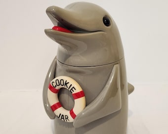 Tarro para galletas vintage de 1996, gris, con forma de delfín parlante y aleta, de Fun Damental. 25,4 cm de alto, 13,3 cm de ancho, funciona correctamente, compartimento de pilas limpio.