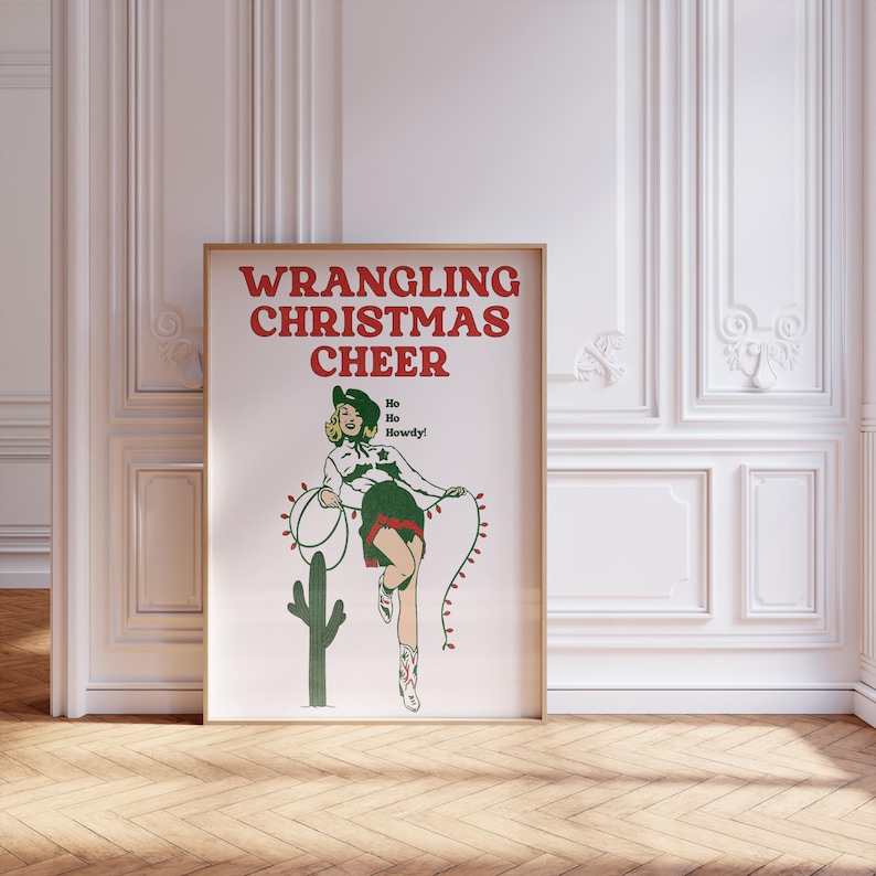May include: A vintage-style poster with the text "WRANGLING CHRISTMAS CHEER" in red letters. A woman in a green and red outfit is lassoing a string of Christmas lights. The text "Ho Ho Howdy!" is written in red letters.