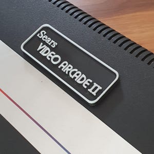 Atari Sears ビデオアーケード II カートリッジスロット ダストカバー - ブラックとシルバー
