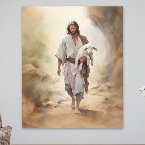 May include: A painting of Jesus walking with a white lamb in his arms. The painting is done in a watercolor style and features a soft, muted color palette. The background is a hazy, desert landscape.