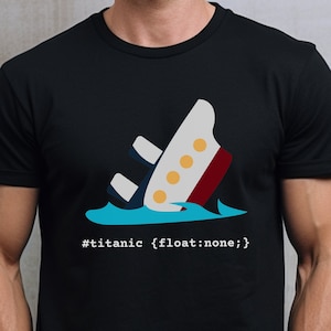 May include: A black t-shirt with a graphic of a sinking ship and the text '#titanic {float: none;}'.