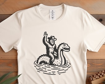 Bigfoot Riding Loch Ness Monster Shirt: Funny Sasquatch Tee