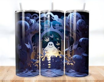 May include: Three stainless steel tumblers with a Halloween theme. The tumblers feature a paper cut-out design of a spooky forest with a ghost in the centre. The design is in shades of blue and white.