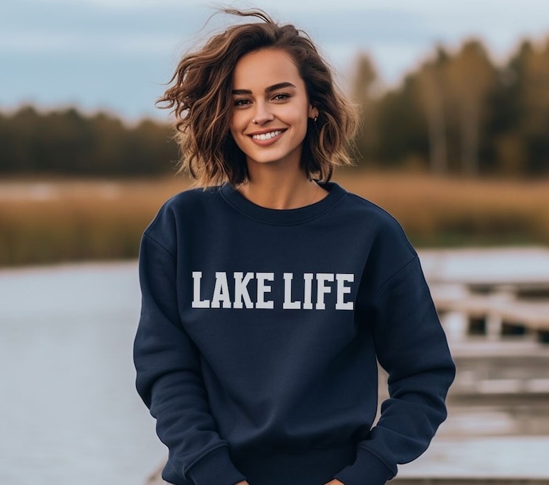 May include: A navy blue sweatshirt with the text "LAKE LIFE" printed in white on the front.