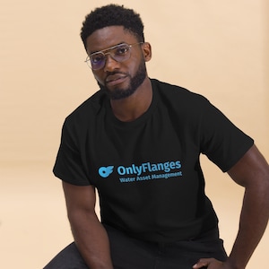 May include: Black t-shirt with the text "OnlyFlanges Water Asset Management" in light blue. The shirt is short-sleeved and appears to be made of a soft material. The design is simple and modern, suitable for casual wear.