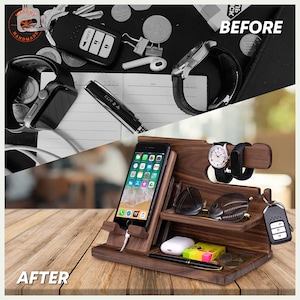 May include: A wooden desk organizer with a phone stand, watch holder, and sunglass shelf. The organizer holds a smartphone, two watches, sunglasses, keys, and other small items. The organizer is made of dark wood and sits on a wooden surface.