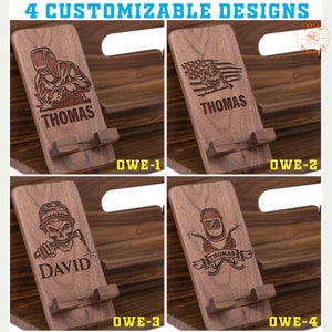May include: Four customizable wooden phone stands with engraved designs. Each stand features a different design, including a welder, an American flag, and a skull welder. The name "THOMAS" or "DAVID" is engraved on each stand.