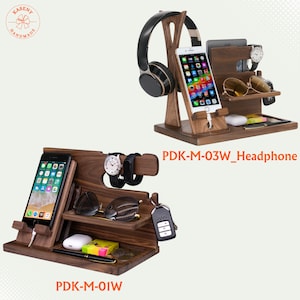 May include: Two wooden organizer stands. One holds a phone, headphones, and accessories. The other holds a phone, watch, sunglasses, and other items. Both are dark brown with multiple compartments and the text "PDK-M-03W_Headphone" and "PDK-M-01W".