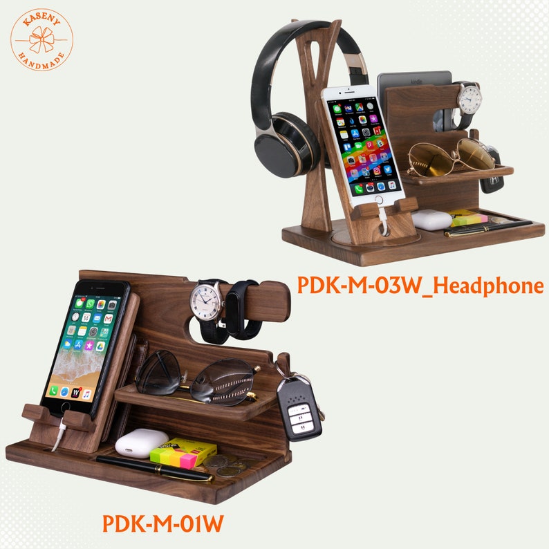 May include: Two wooden organizer stands. One holds a phone, headphones, and accessories. The other holds a phone, watch, sunglasses, and other items. Both are dark brown with multiple compartments and the text "PDK-M-03W_Headphone" and "PDK-M-01W".