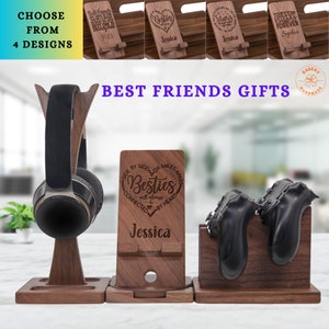 May include: Wooden phone and headphone stand with a heart design and the text "Besties will always be connected by heart". The stand is personalized with the name "Jessica".