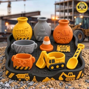 May include: A black construction-themed tray holding various items including a yellow dump truck jar, a gray traffic cone jar, an orange cement mixer jar, a gray bowl, an orange traffic cone, a yellow excavator, a yellow shovel, and a sign reading WORK ZONE.