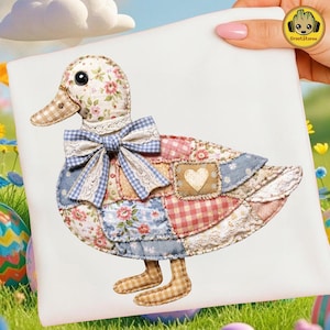 May include: A decorative duck design with a patchwork body, featuring floral, gingham, and solid fabric patterns. The duck has a bow with lace trim and a heart-shaped patch. The design is on a white background.