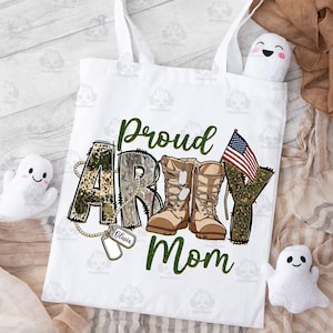 May include: White tote bag with a green, brown, and black camouflage print that says "Proud Army Mom" with a pair of brown military boots and a small American flag.