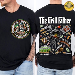 May include: Black t-shirt with "The Grillfather" graphic on the front and back. The front features a skull chef with flames, while the back has BBQ-themed illustrations and text. The shirt is a perfect gift for grilling enthusiasts.