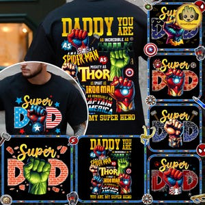 May include: Black t-shirt with a graphic featuring the text "DADDY YOU ARE MY SUPER HERO" and superhero fists. The design includes Spider-Man, Hulk, Thor, Iron Man, and Captain America elements. Additional "Super Dad" designs are also shown.