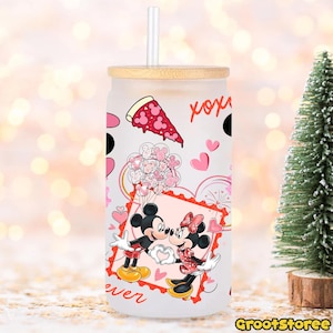 May include: A frosted glass tumbler with a bamboo lid and straw. The tumbler features a design with Mickey and Minnie Mouse kissing, pink hearts, and a pizza slice. The word "forever" is written on the bottom.