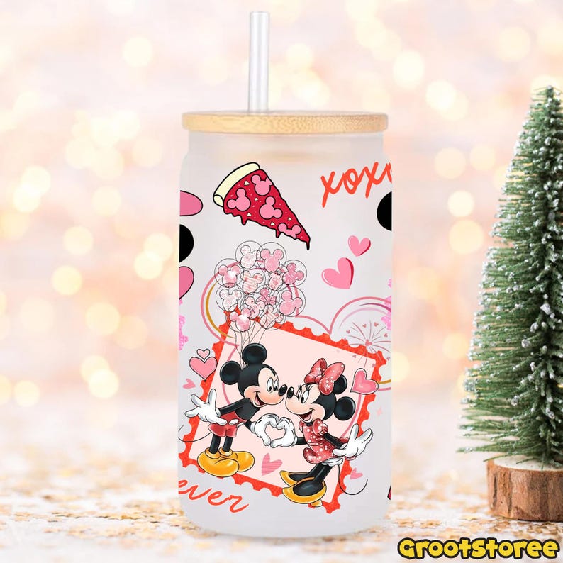 May include: A frosted glass tumbler with a bamboo lid and straw. The tumbler features a design with Mickey and Minnie Mouse kissing, pink hearts, and a pizza slice. The word "forever" is written on the bottom.