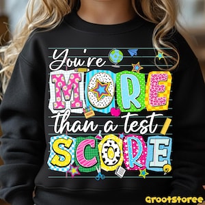 May include: A white ceramic mug with a black handle and the text "But First, Coffee" in a handwritten style. The mug is on a white surface. The mug is approximately 4 inches tall.