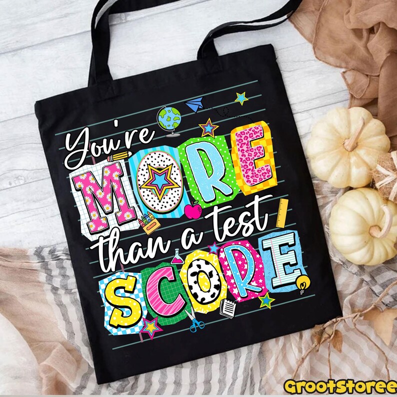 May include: A white ceramic mug with a black handle and the text "But First, Coffee" in a black, bold font. The mug is on a white surface. The mug is approximately 4 inches tall.