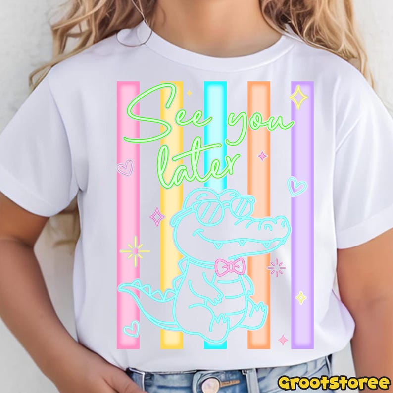 May include: White t-shirt featuring a neon alligator wearing sunglasses and a bow tie, with the text "See you later." Vertical stripes in pink, blue, orange, yellow, and purple are behind the alligator.