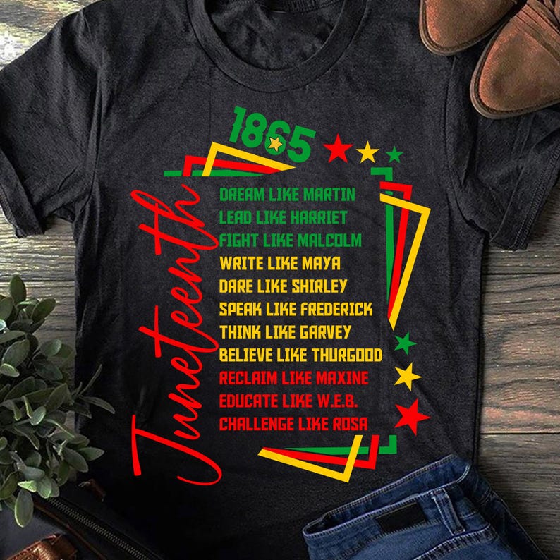 May include: Dark gray t-shirt with the word "Juneteenth" in red script. The shirt features text in green, red, and yellow, including "1865" and phrases like "Dream like Martin" and "Lead like Harriet."