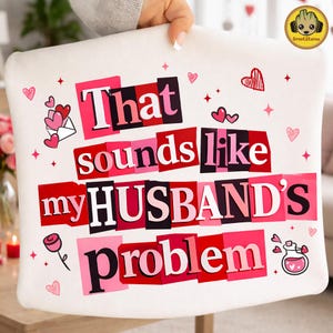 May include: White pillow with the text "That sounds like my HUSBAND'S problem" in a collage style with pink and red accents. The pillow has Valentine's Day themed graphics, including hearts and a rose.