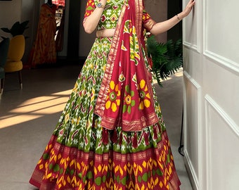Green Red women designer party wear Embrace the elegance of patola prints, where tradition meets trend in every twirl of a printed lehenga