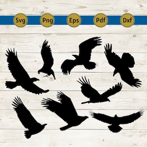 May include: Black silhouette images of eagles in various flying poses. The image includes text labels: SVG, PNG, EPS, PDF, and DXF, set against a white wood grain background with a blue and gold stripe.