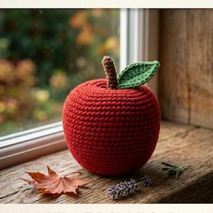 May include: A red crochet apple with a brown stem and a green leaf. The text CROCHET APPLE PATTERN is at the top, and INSTANT DOWNLOAD HIGH QUALITY is at the bottom. The apple is a round, textured fiber craft item with a visible stitch pattern.
