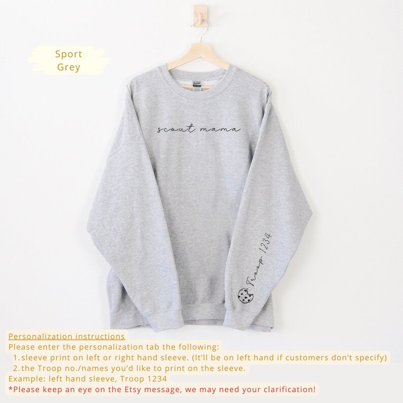 May include: Gray sweatshirt with the text "scout mama" printed on the front and "Troop 1234" printed on the left sleeve.