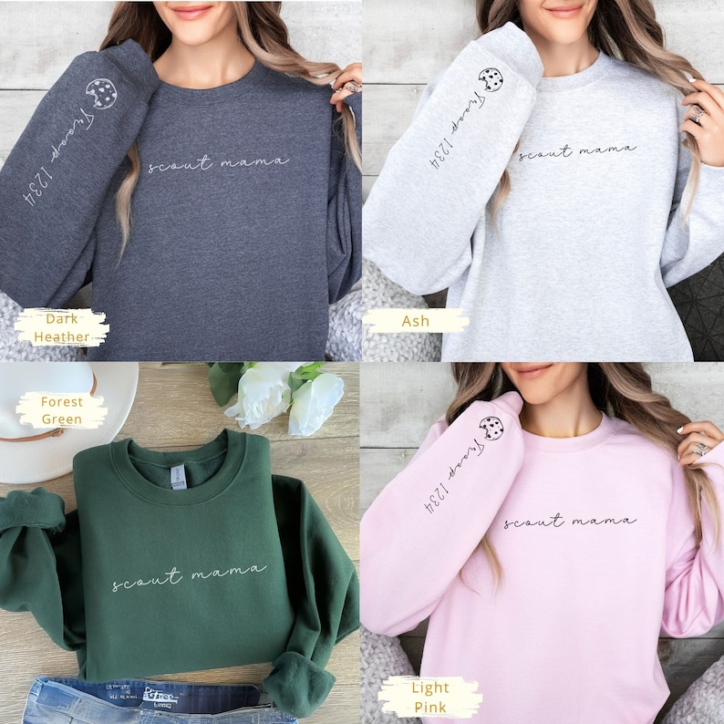 May include: Four crew neck sweatshirts in different colors: dark heather, ash, forest green, and light pink. Each sweatshirt has the text "scout mama" on the front and a cookie graphic on the sleeve with the text "Troop 1234".