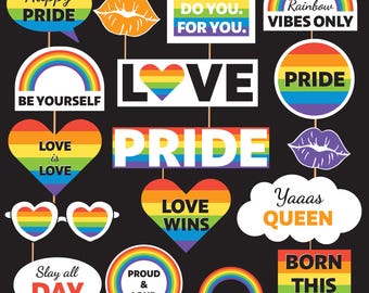 May include: A collection of Pride-themed photo booth props on black. Includes speech bubbles with "Happy PRIDE" and "Slay all DAY", heart-shaped props with "LOVE is LOVE" and "LOVE WINS", and signs with "BE YOU. DO YOU. FOR YOU."