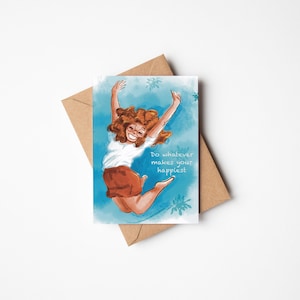 May include: A digital illustration of a woman with brown hair jumping in the air with her arms raised. The background is a blue watercolor wash with white flowers. The text "Do whatever makes you happiest" is written in white below the woman.