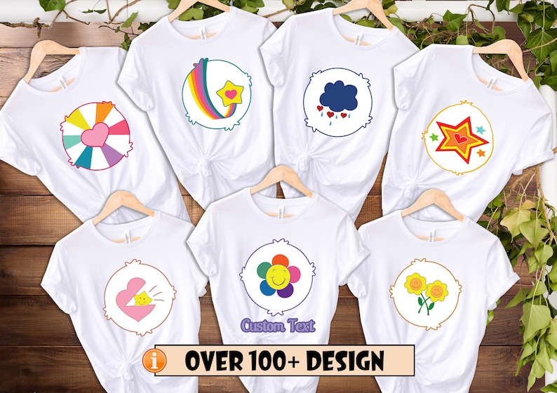 May include: Six white t-shirts with different Care Bear designs printed on the front. The designs include a rainbow, a cloud with raindrops, a star, a flower, a heart with a sunbeam, and two sunflowers. The text "OVER 100+ DESIGN" is printed at the bottom of the image.