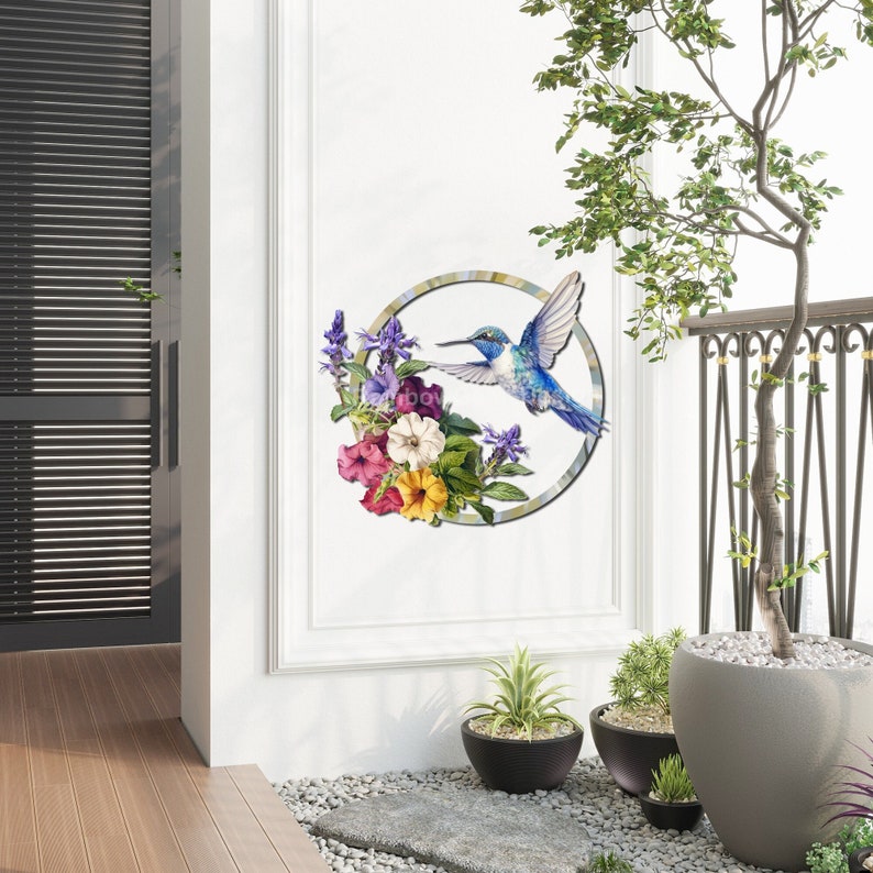May include: A blue hummingbird in flight with a circle of colorful flowers around it. The image is a wall decal.