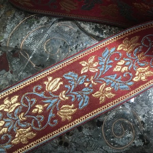 Blue/Beige /Gold Filigree on Burgundy Background - Embroidered Jacquard Ribbon - 6 cm Wide.