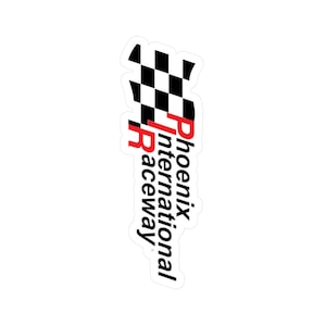 May include: A white sticker with the Phoenix International Raceway logo. It features a black and white chequered flag and the words "Phoenix International Raceway" in black and red.