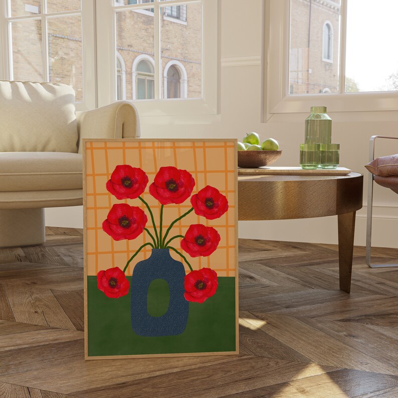 May include: A painting of a bouquet of red poppies in a blue vase. The vase is on a green background with a yellow and orange grid pattern.