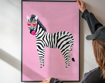 May include: A framed wall art print featuring a black and white zebra standing against a solid pink background. The zebra is wearing red heart-shaped sunglasses and is blowing a bright pink bubble with bubblegum.