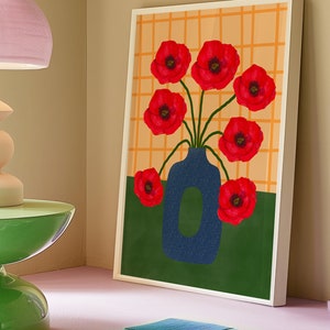 May include: A framed print of a blue vase with red poppy flowers against a yellow and green background. The vase is textured and the flowers are stylized.